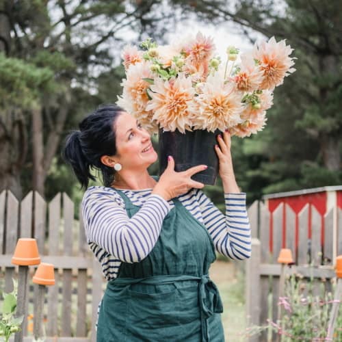 janae w pot of flowers on shoulder